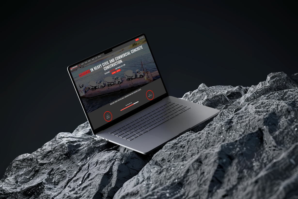 precision construction website showing on laptop